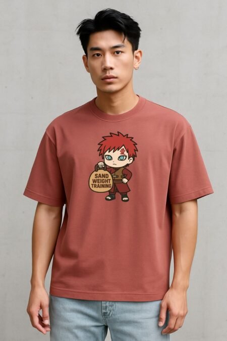 Model wearing red oversized anime t-shirt with chibi Gara and sand weight training design – funny Naruto parody gym tee