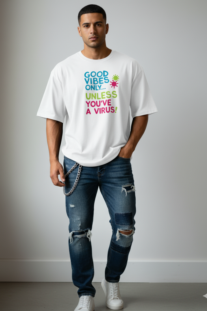 Good vibes only,unless you have a virus. photo of a 24-year-old white Indian male supermodel wearing a white oversized t-shirt with 'GOOD VIBES ONLY...' text and stylishly designed light-wash jeans, posing against a plain background